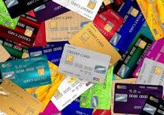 Here's an alt tag for the image: `Pile of colorful credit cards`